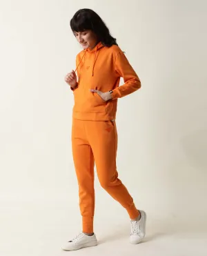 Rareism Women Simp-1 Orange Poly Cotton Fabric Tailored Fit Solid Mid Rise Ankle Length Track Pant